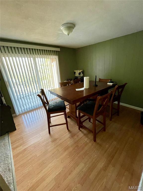 3159 Dorman Rd, Festus, MO 63028 - dining space with light wood-style flooring and a textured ceiling