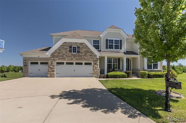 612 Savannah View Way, Chesterfield, MO 63017 - view of front facade with concrete driveway, a front yard, stone siding, an attached garage, and a porch