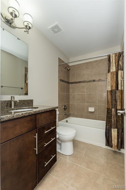 612 Savannah View Way, Chesterfield, MO 63017 - bathroom featuring tile patterned flooring, vanity, shower / tub combo, and toilet