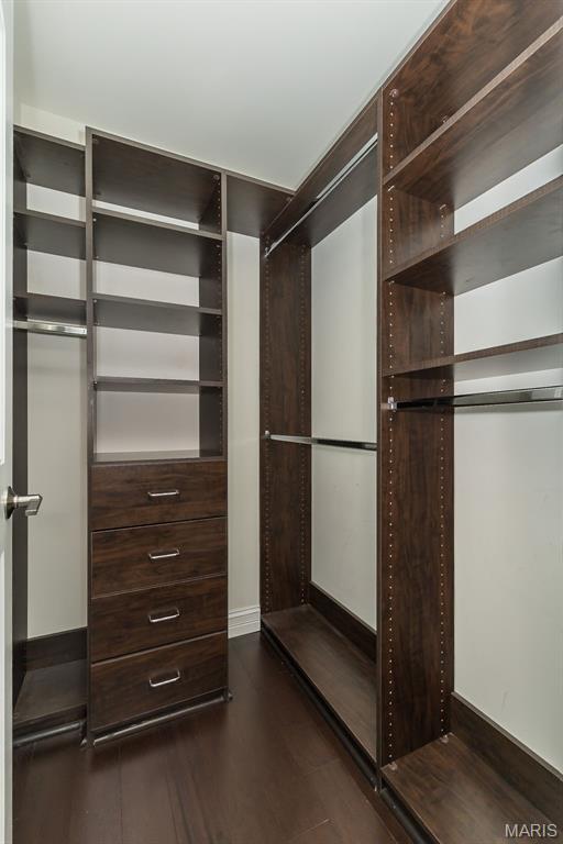 612 Savannah View Way, Chesterfield, MO 63017 - walk in closet featuring dark wood-type flooring