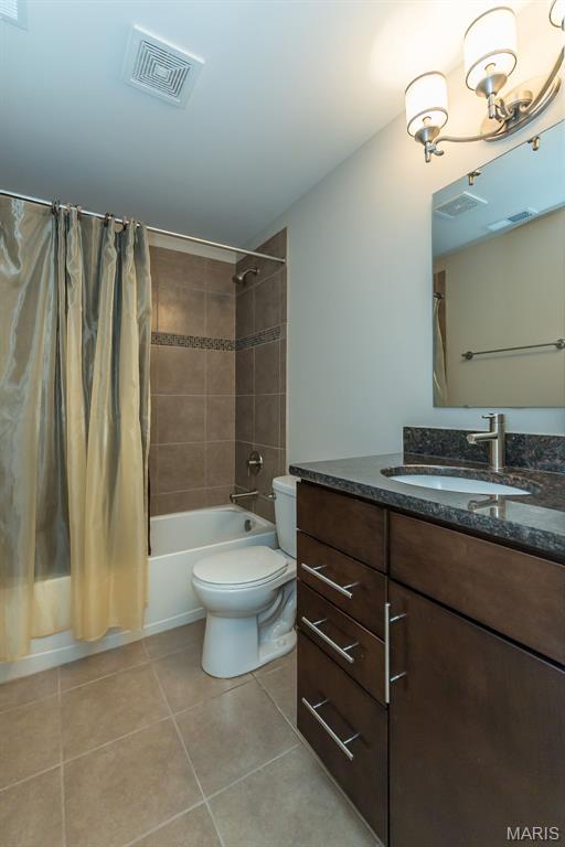 612 Savannah View Way, Chesterfield, MO 63017 - full bath featuring tile patterned floors, shower / bath combo, toilet, and vanity