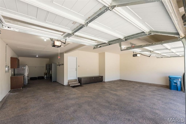 612 Savannah View Way, Chesterfield, MO 63017 - garage with a garage door opener, freestanding refrigerator, and refrigerator