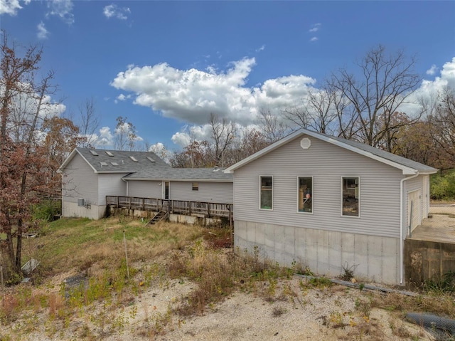 29379 Trails End Unit A & B, Wright City, MO 63390 - view of side of property featuring a wooden deck and a shingled roof