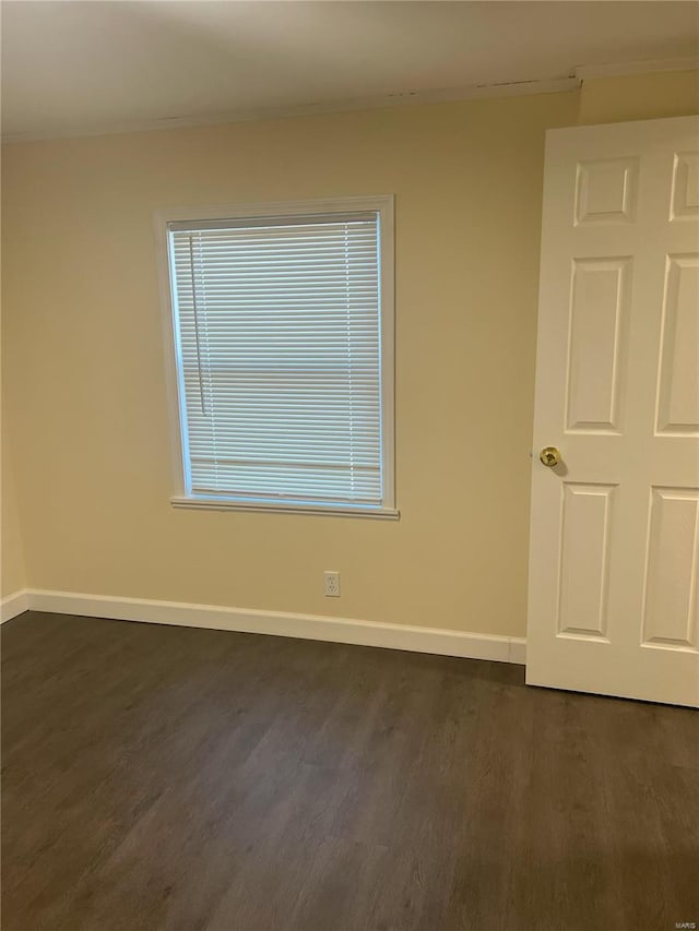 29379 Trails End Unit A & B, Wright City, MO 63390 - unfurnished room featuring dark wood-style flooring, baseboards, and crown molding