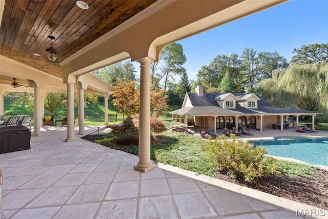 1 Claychester Dr, Saint Louis, MO 63131 - view of patio / terrace with an outdoor pool, an exterior structure, a ceiling fan, and an outdoor structure