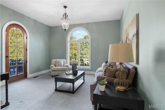 1 Claychester Dr, Saint Louis, MO 63131 - carpeted living room with baseboards and arched walkways