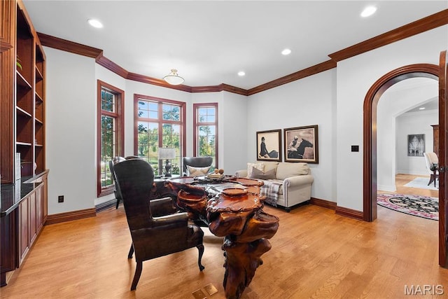 1 Claychester Dr, Saint Louis, MO 63131 - dining area featuring light wood-style floors, baseboards, recessed lighting, arched walkways, and ornamental molding