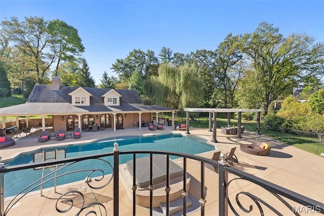 1 Claychester Dr, Saint Louis, MO 63131 - view of swimming pool featuring a patio, outdoor lounge area, and view of scattered trees