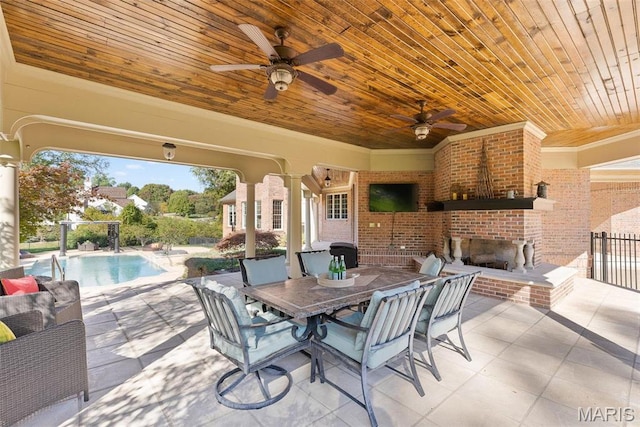 1 Claychester Dr, Saint Louis, MO 63131 - view of patio / terrace with an outdoor brick fireplace, ceiling fan, an outdoor pool, and outdoor dining area