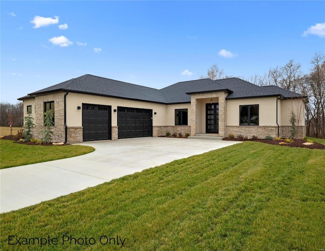 prairie-style house with stone siding, a garage, concrete driveway, stucco siding, and a front yard