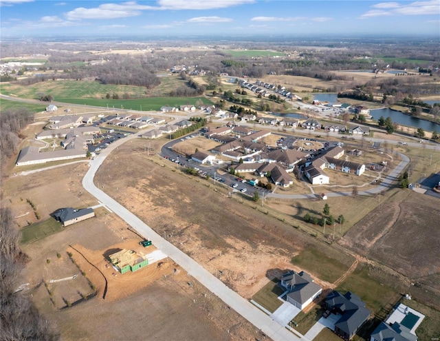 aerial view of property's location with a large body of water