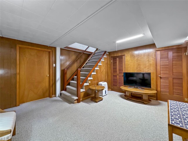 13 N Jackson St, Millstadt, IL 62260 - living area with carpet, wooden walls, and stairs