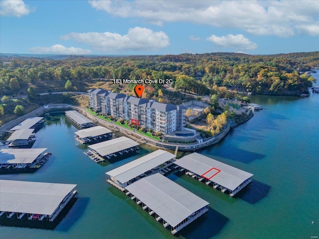 bird's eye view of a nearby body of water and a heavily wooded area