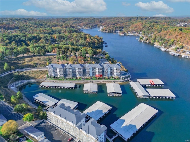 bird's eye view of a heavily wooded area and a large body of water