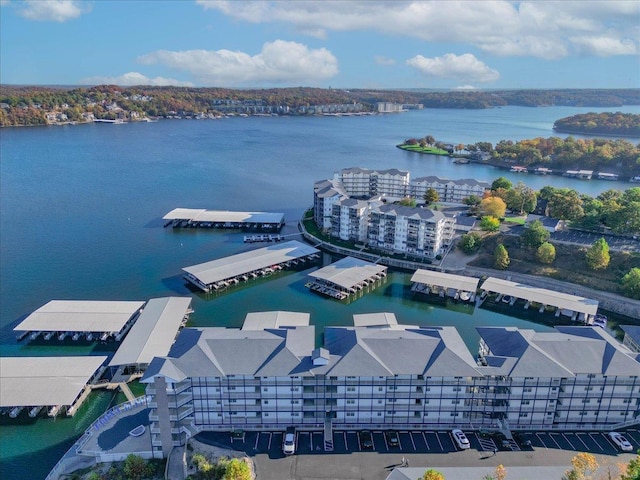 bird's eye view of apartment complex and a nearby body of water