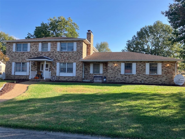 660 W 3rd, Trenton, IL 62293 - view of front of home with a chimney, a front lawn, and brick siding