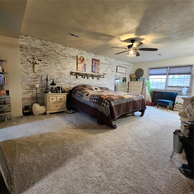 660 W 3rd, Trenton, IL 62293 - carpeted bedroom featuring a ceiling fan and a wood stove