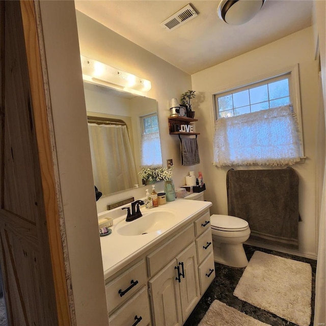 660 W 3rd, Trenton, IL 62293 - bathroom featuring vanity, toilet, and a shower with shower curtain