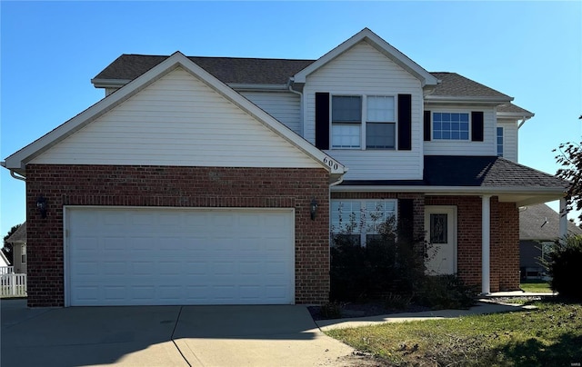 traditional home featuring brick siding, driveway, and a shingled roof