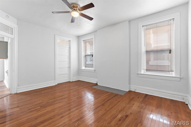 3921 Shenandoah Ave, Saint Louis, MO 63110 - spare room with hardwood / wood-style flooring, a ceiling fan, and baseboards