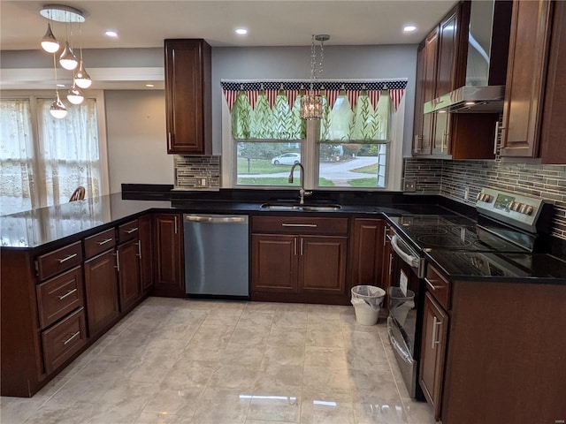7 Carole Ln, Frontenac, MO 63131 - kitchen with stainless steel appliances, a sink, wall chimney range hood, a peninsula, and backsplash