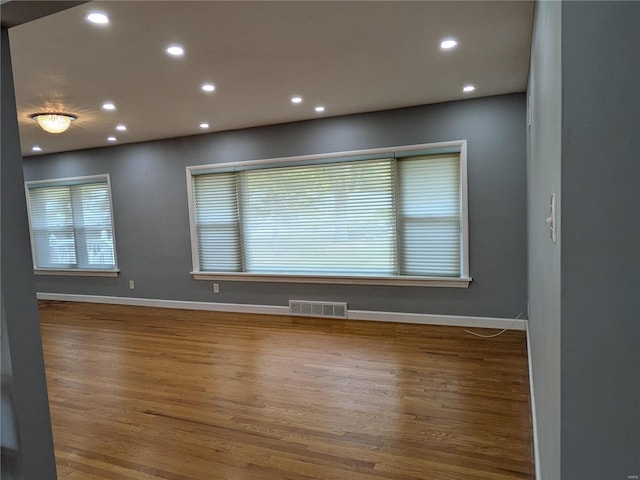 7 Carole Ln, Frontenac, MO 63131 - spare room featuring wood finished floors, recessed lighting, and baseboards