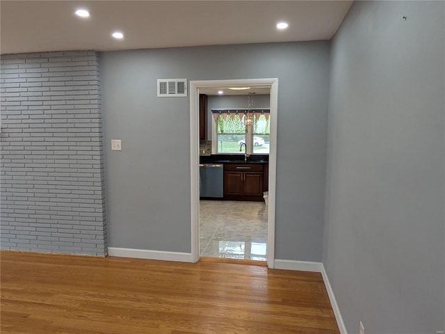 7 Carole Ln, Frontenac, MO 63131 - hall with recessed lighting, a sink, light wood-style floors, and baseboards