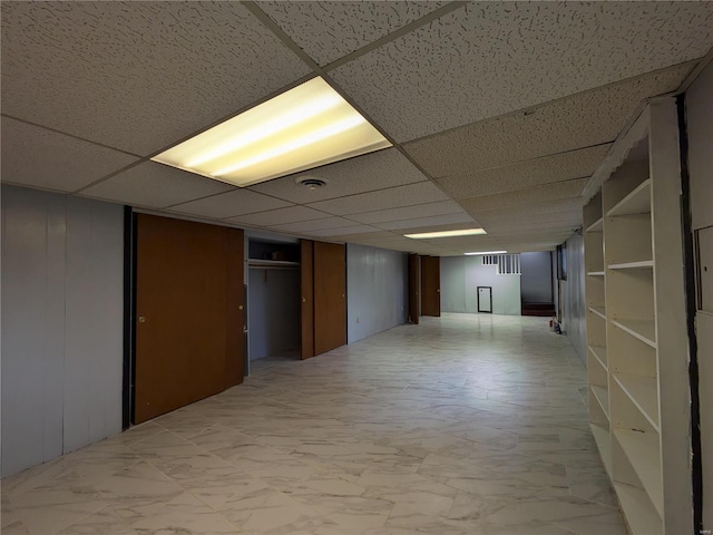 7 Carole Ln, Frontenac, MO 63131 - finished below grade area featuring a paneled ceiling and light marble finish flooring