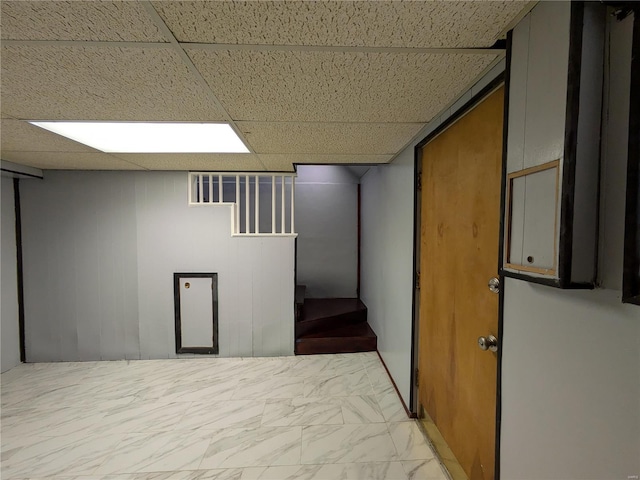 7 Carole Ln, Frontenac, MO 63131 - finished below grade area with marble look tile flooring and a drop ceiling