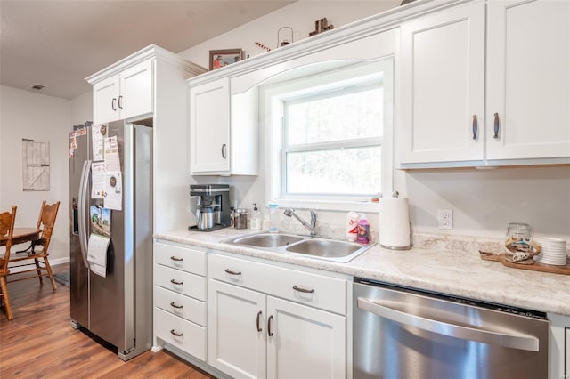 45 Justin Ave, Van Buren, MO 63965 - kitchen featuring stainless steel appliances, a sink, white cabinetry, and light wood finished floors