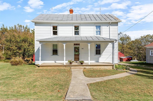 94 Jersey Ln, Bloomsdale, MO 63627 - view of front facade with a standing seam roof, metal roof, covered porch, and a front lawn