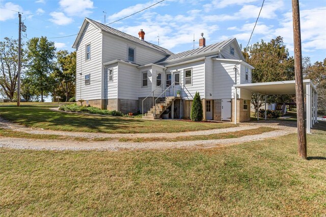 94 Jersey Ln, Bloomsdale, MO 63627 - view of property exterior featuring driveway, a standing seam roof, metal roof, a chimney, and a yard