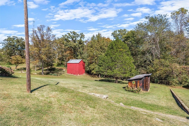 94 Jersey Ln, Bloomsdale, MO 63627 - view of green lawn featuring a shed and an outbuilding