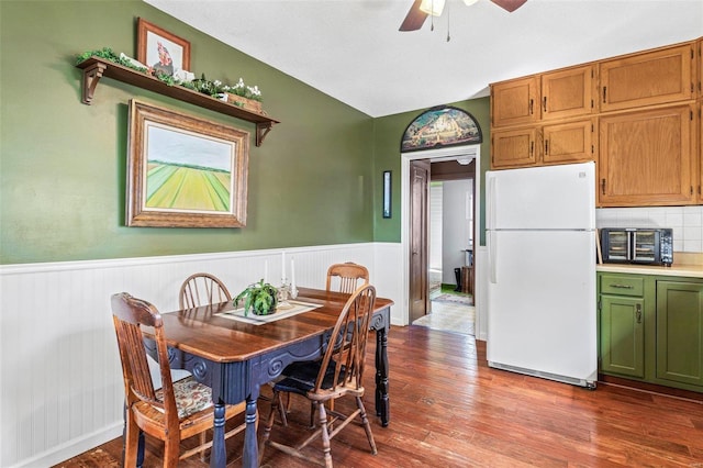 94 Jersey Ln, Bloomsdale, MO 63627 - dining area featuring a ceiling fan, wainscoting, wood finished floors, and lofted ceiling