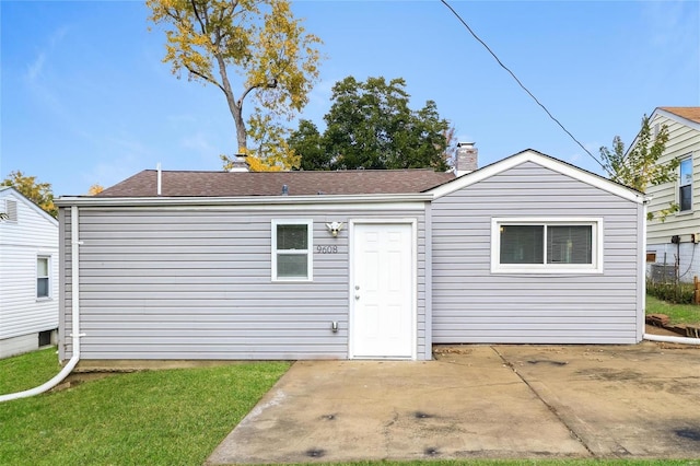 9608 Flora Ave, Saint Louis, MO 63114 - rear view of property with a patio area, a chimney, and a shingled roof