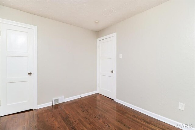 9608 Flora Ave, Saint Louis, MO 63114 - unfurnished room featuring baseboards and wood finished floors