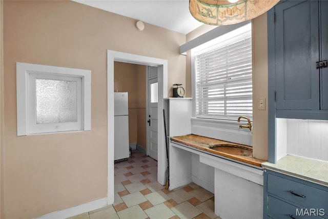 5099 Waterman Blvd, Saint Louis, MO 63108 - bathroom with a sink and baseboards