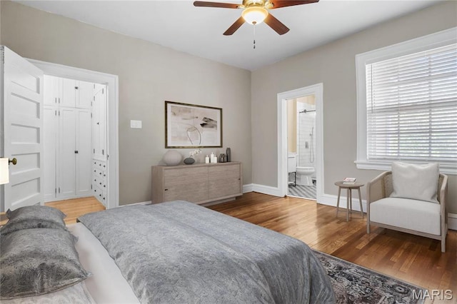 5099 Waterman Blvd, Saint Louis, MO 63108 - bedroom featuring wood finished floors, baseboards, ceiling fan, and ensuite bath