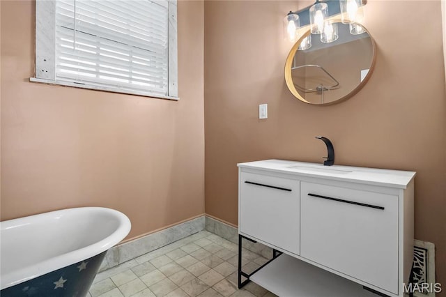 5099 Waterman Blvd, Saint Louis, MO 63108 - full bath with a freestanding tub, vanity, and baseboards