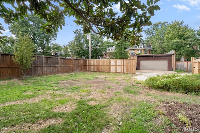 5099 Waterman Blvd, Saint Louis, MO 63108 - view of yard featuring an outdoor structure and a detached garage