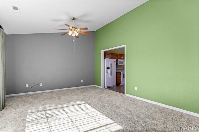 119 Ohio Ct, Farmington, MO 63640 - unfurnished room with dark colored carpet, ceiling fan, baseboards, and vaulted ceiling