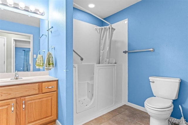 119 Ohio Ct, Farmington, MO 63640 - bathroom featuring toilet, vanity, baseboards, and tile patterned flooring