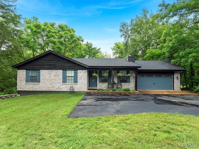 575 E Villa Ridge Rd, Villa Ridge, MO 63089 - ranch-style home with a front lawn, a chimney, a garage, asphalt driveway, and roof with shingles