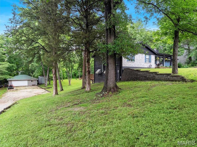 575 E Villa Ridge Rd, Villa Ridge, MO 63089 - view of green lawn with a detached garage and dirt driveway