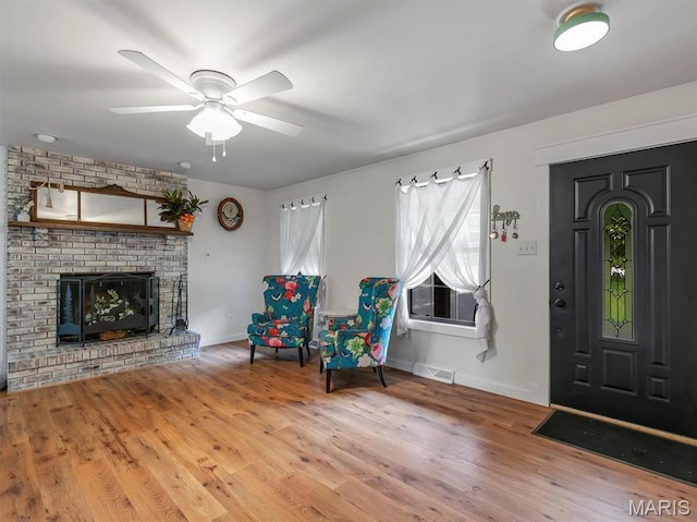 575 E Villa Ridge Rd, Villa Ridge, MO 63089 - foyer entrance featuring wood finished floors, ceiling fan, and a fireplace