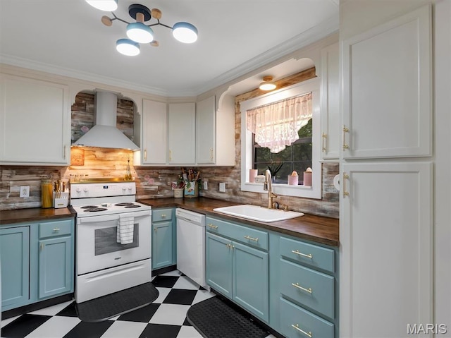 575 E Villa Ridge Rd, Villa Ridge, MO 63089 - kitchen with white appliances, wall chimney range hood, blue cabinets, dark flooring, and ornamental molding