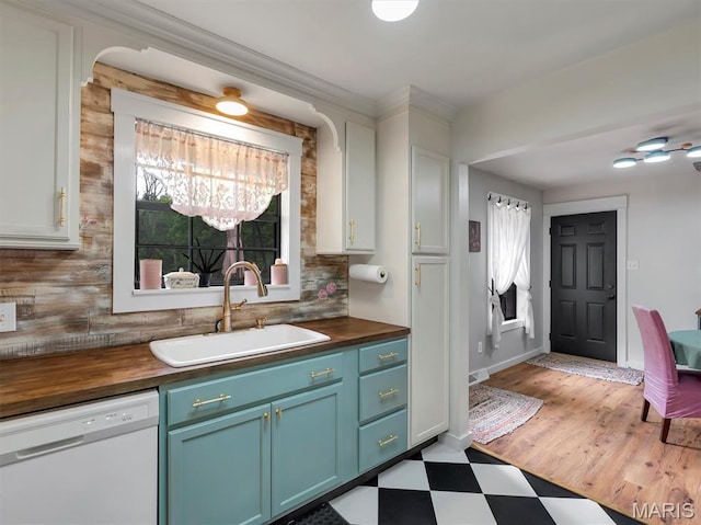 575 E Villa Ridge Rd, Villa Ridge, MO 63089 - kitchen featuring dishwasher, butcher block counters, light floors, backsplash, and ornamental molding