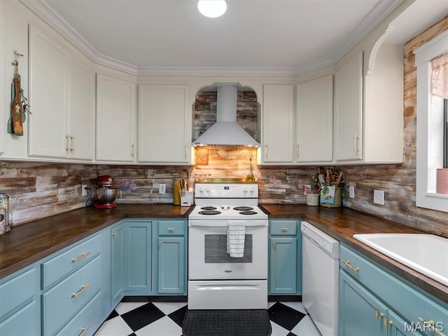 575 E Villa Ridge Rd, Villa Ridge, MO 63089 - kitchen featuring white appliances, blue cabinetry, wall chimney exhaust hood, and tile patterned floors