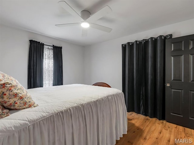 575 E Villa Ridge Rd, Villa Ridge, MO 63089 - bedroom with wood finished floors and a ceiling fan