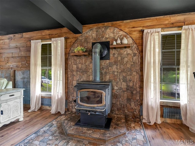 575 E Villa Ridge Rd, Villa Ridge, MO 63089 - detailed view of wood finished floors, beamed ceiling, wood walls, and a wood stove